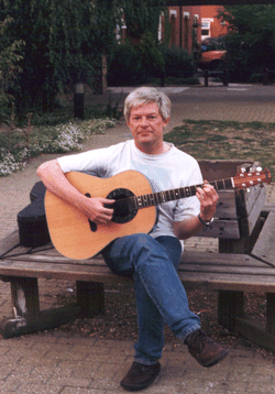 Deacon playing guitar